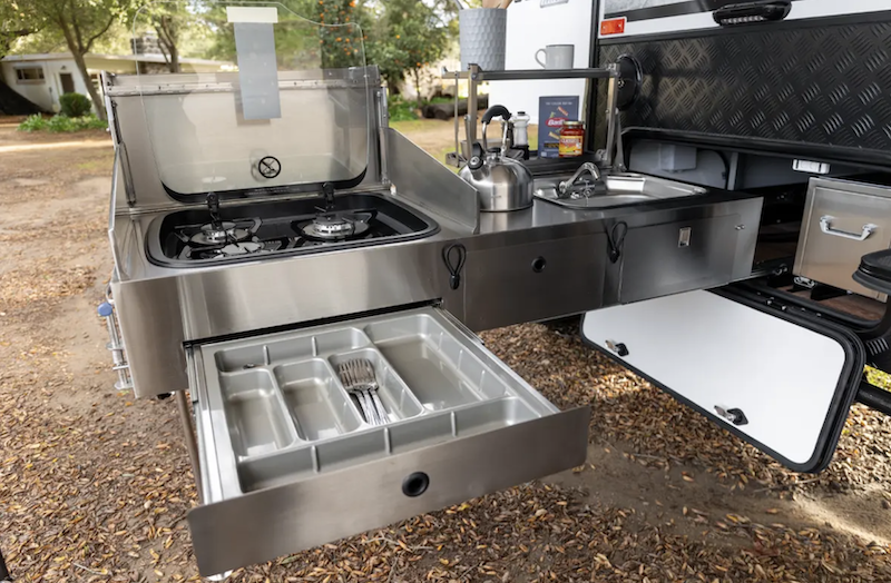 Outdoor kitchen on off-road travel trailer